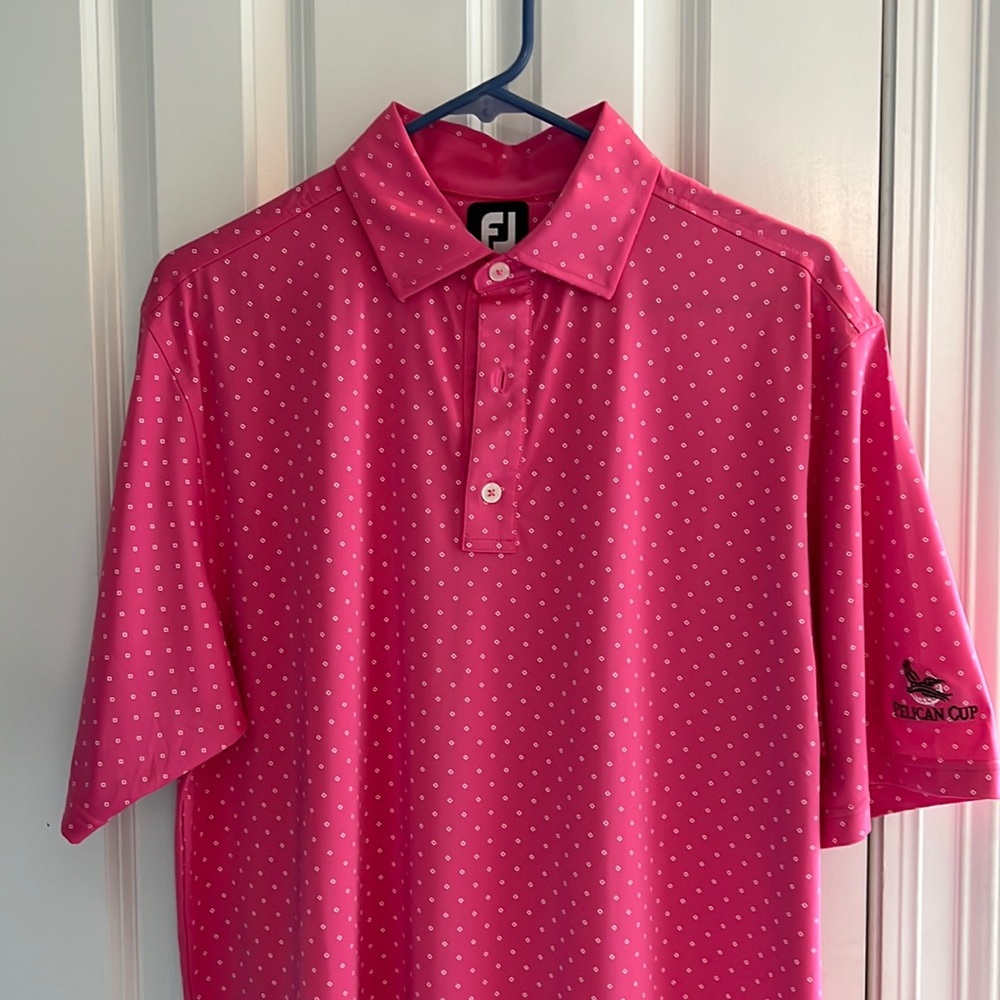 Medium pink FootJoy golf shirt.